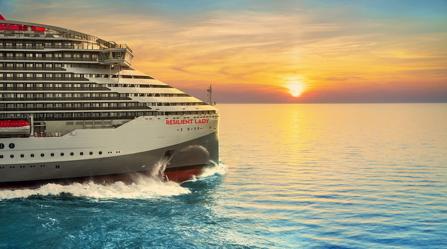 Virgin Voyages cruise ship Resilient Lady at sunset